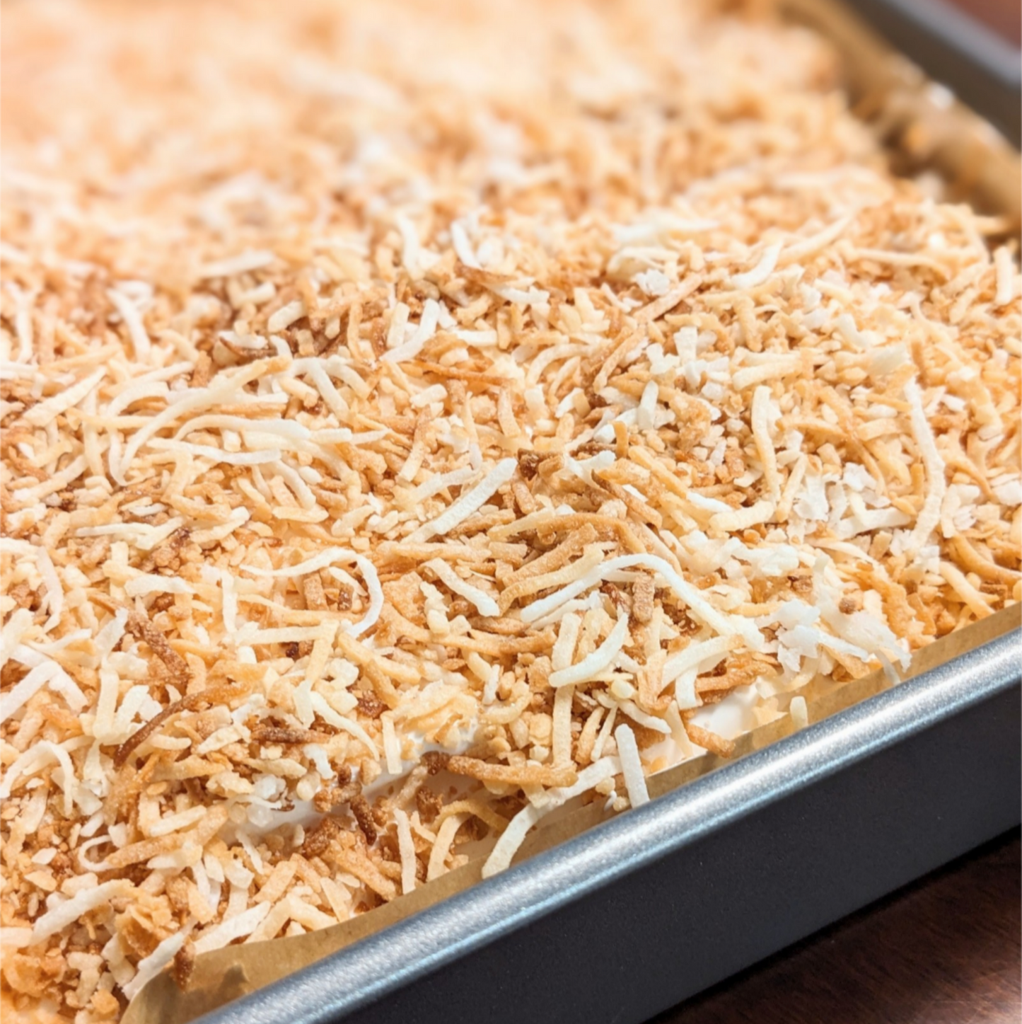 Slab of toasted coconut marshmallows, in the pan