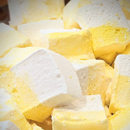 Pile of lemon meringue marshmallows, yellow and white, freshly cut
