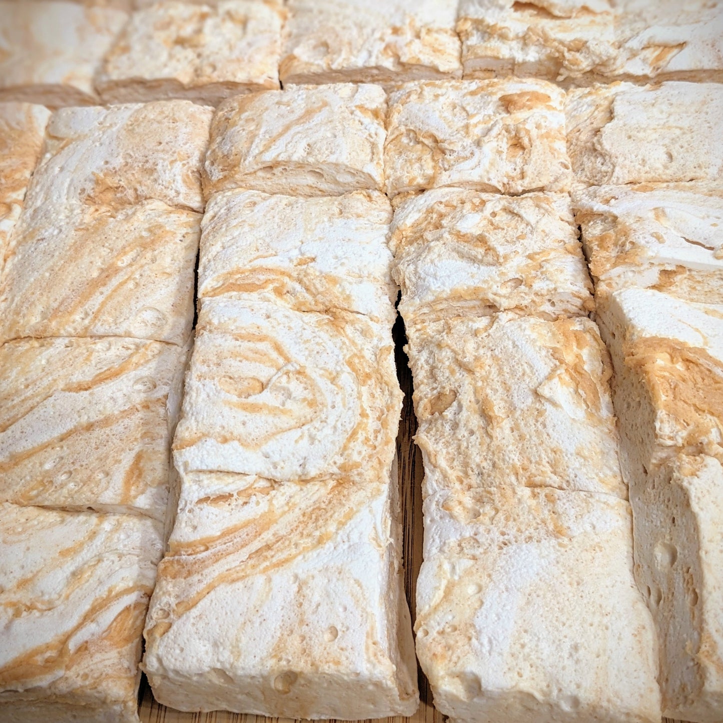 Freshly cut peanut butter marshmallows, with peanut butter swirl