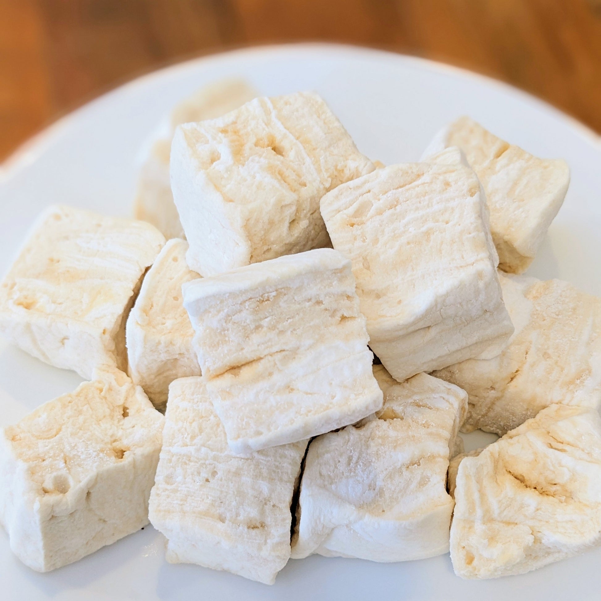 Pile of tahini marshmallows, on a white plate