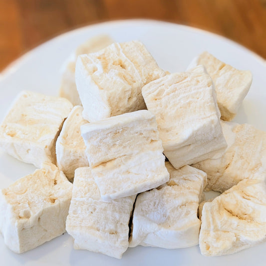 Pile of tahini marshmallows, on a white plate